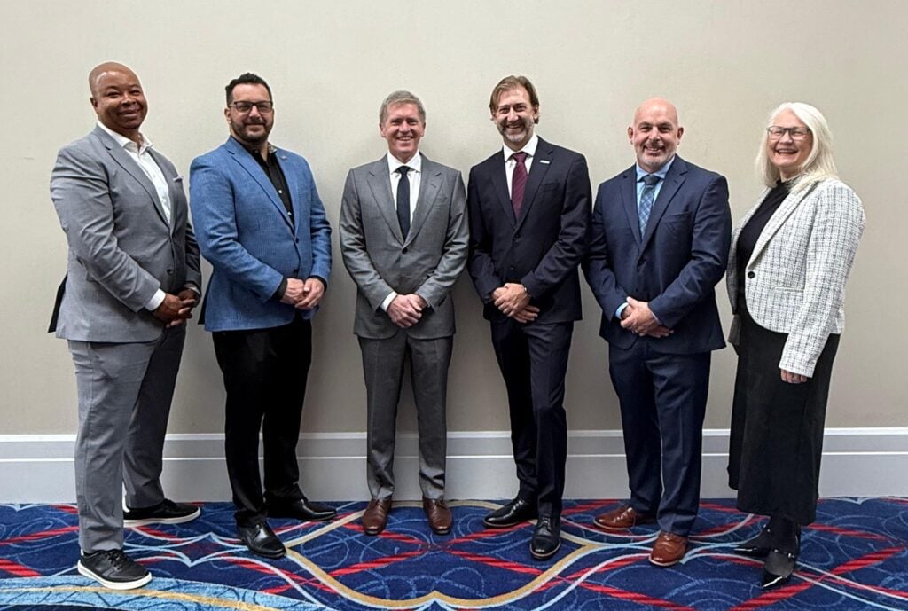 Birdon and Mythos executives stand together at Sea Air Space